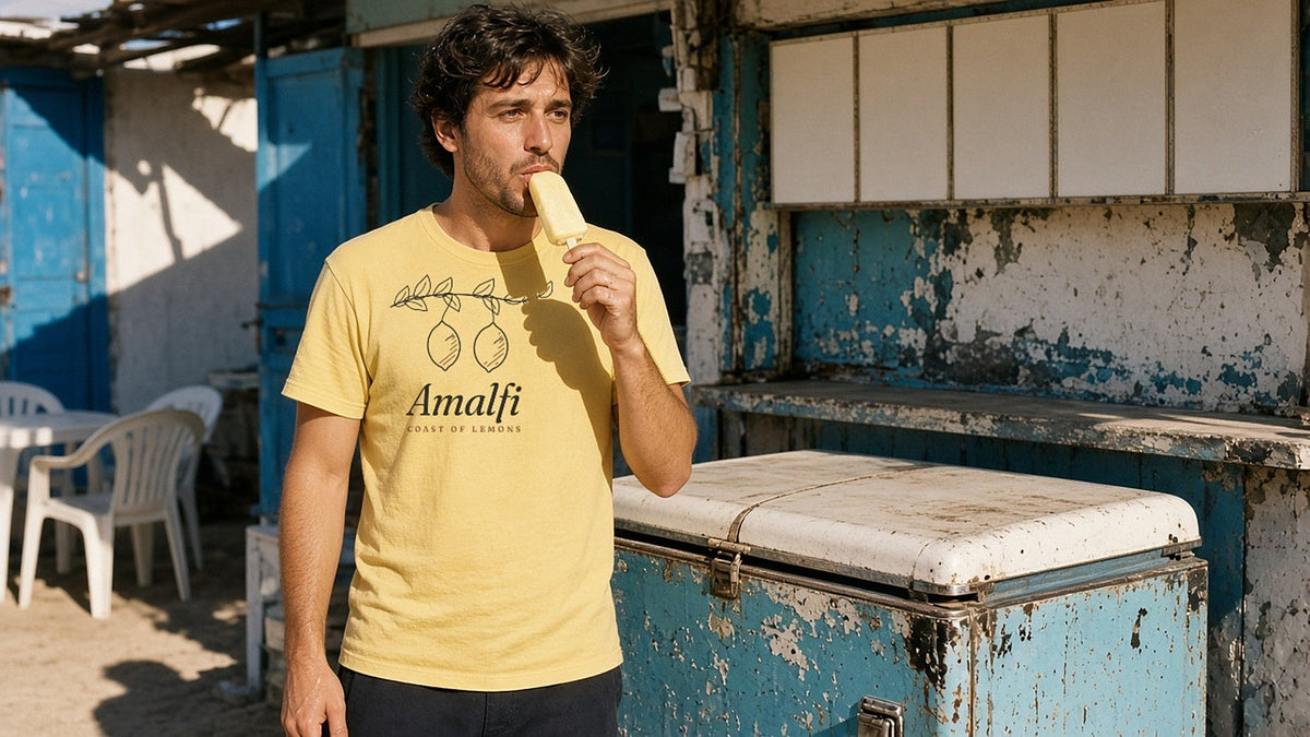 Ice cream by a peeling blue kiosk, hard sun - The Amalfi Tee - Good Vibes Bad Ideas