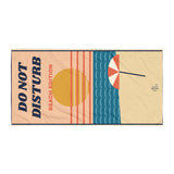 The Do Not Disturb Beach Towel, laid flat