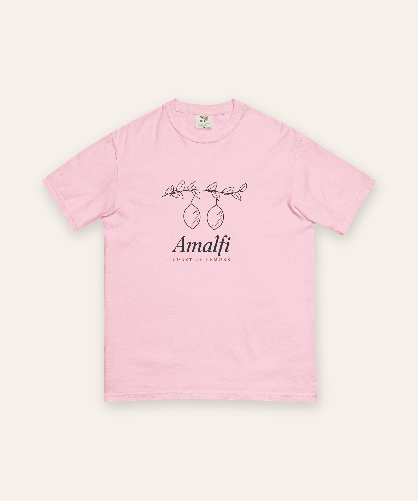 The Amalfi Tee in Blossom, flat lay front, product shot on cream