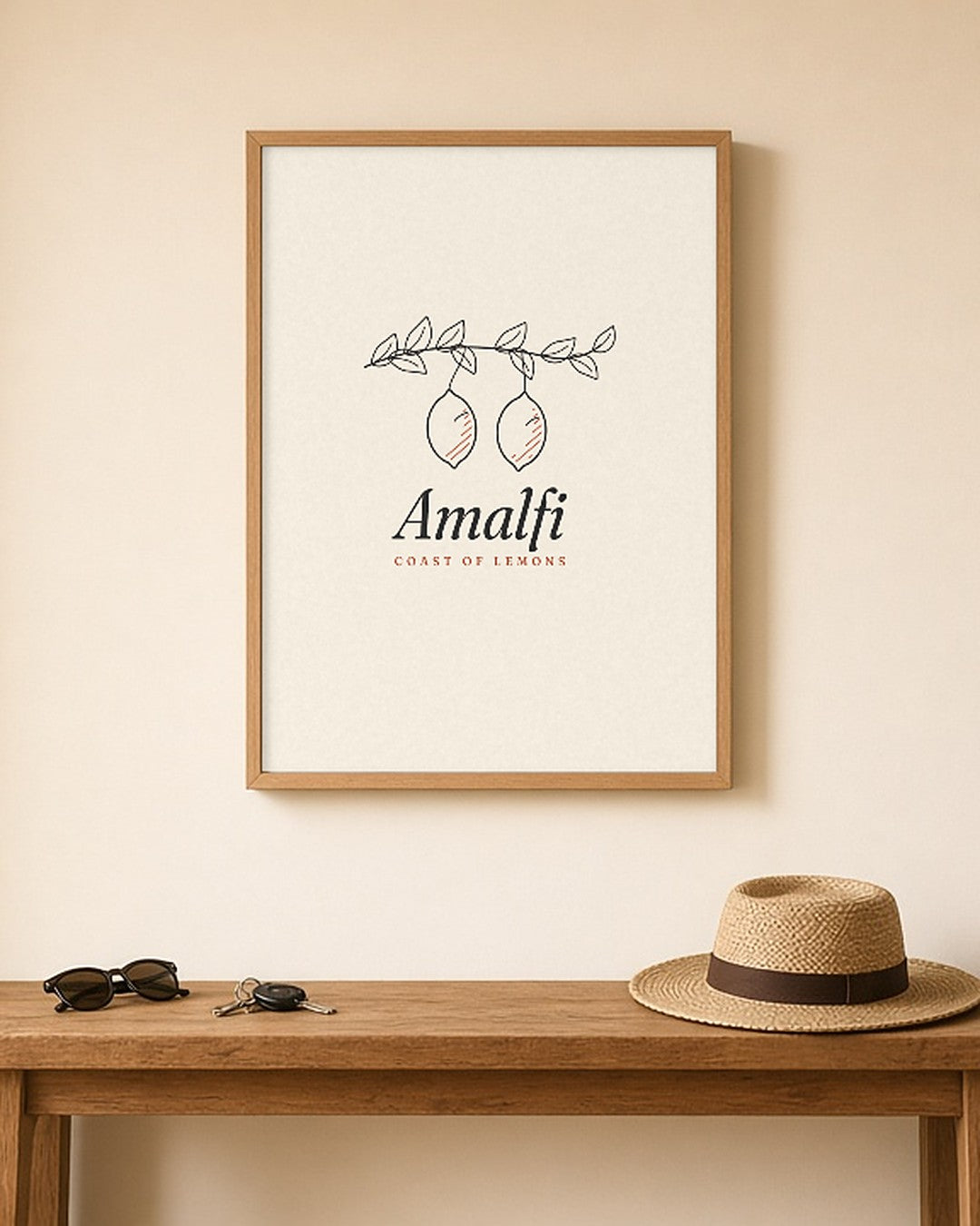 The Amalfi Art Print, framed above a hallway console with sunglasses and a straw hat