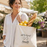 The Amalfi Tote in Oyster, overfilled and carried through a sunny farmers market