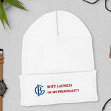 The Soft Launch Beanie in White, flat lay with a watch and glasses