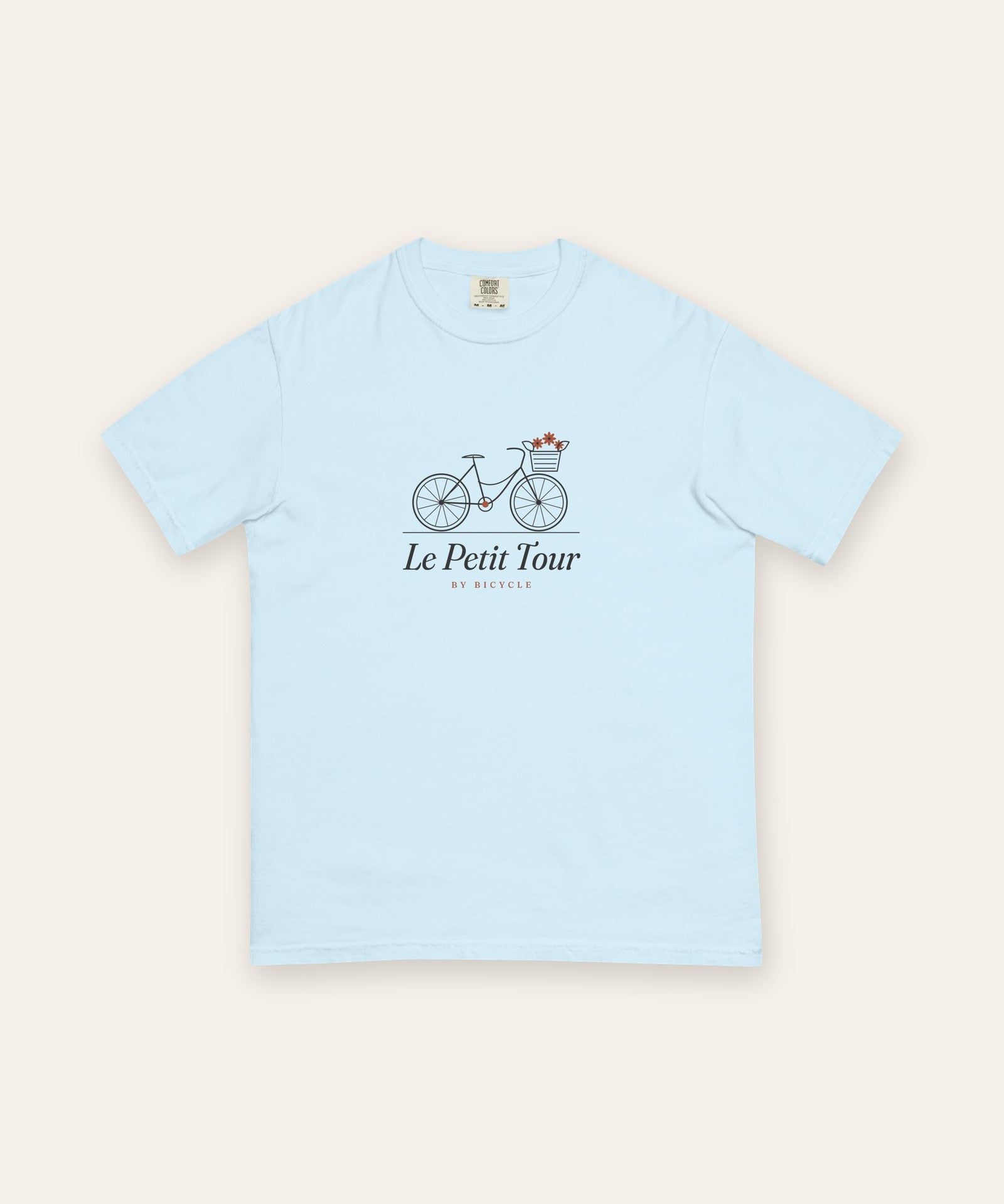 Le Petit Tour Tee in Chambray, flat lay front, product shot on cream