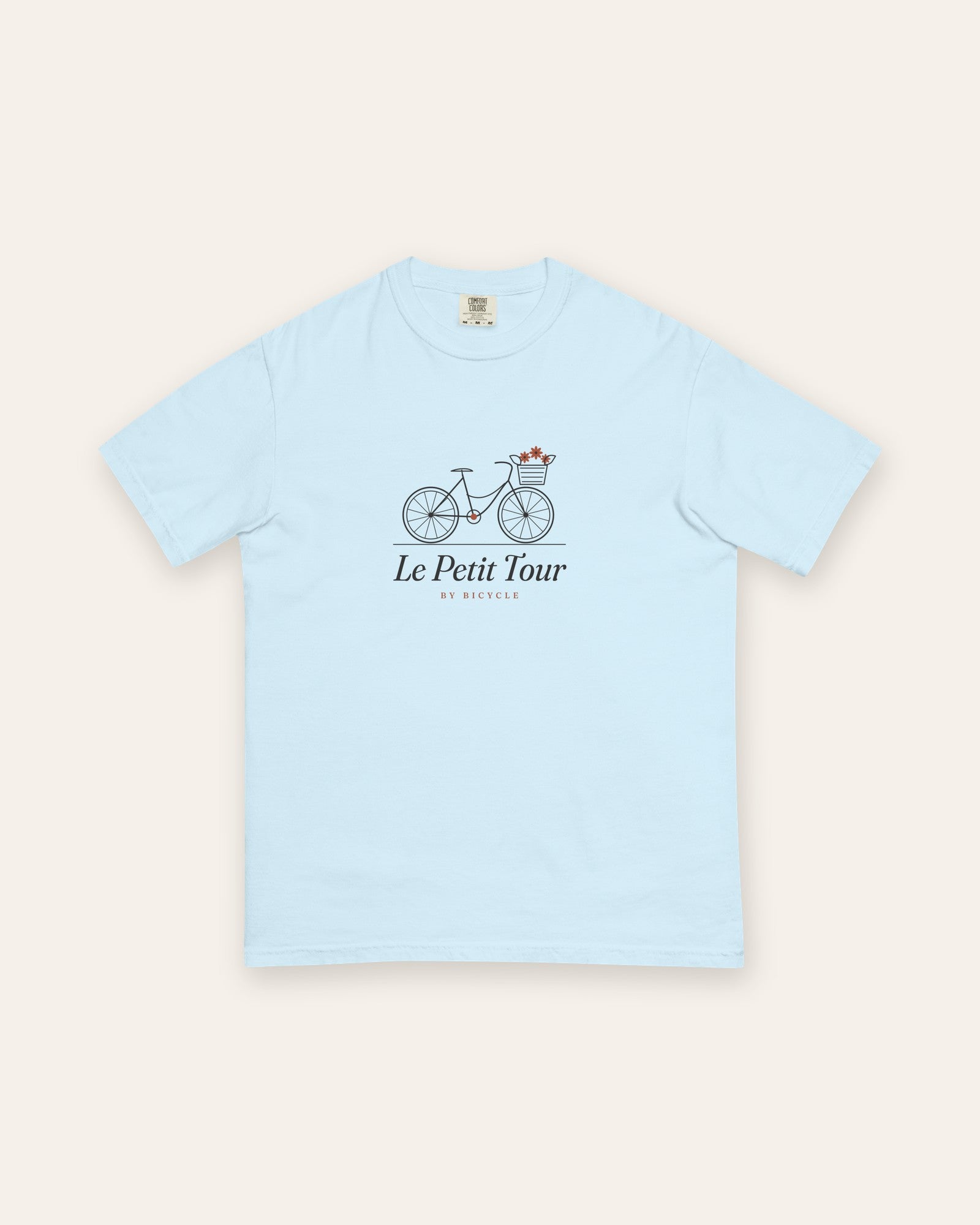 Le Petit Tour Tee in Chambray, flat lay front, product shot on cream