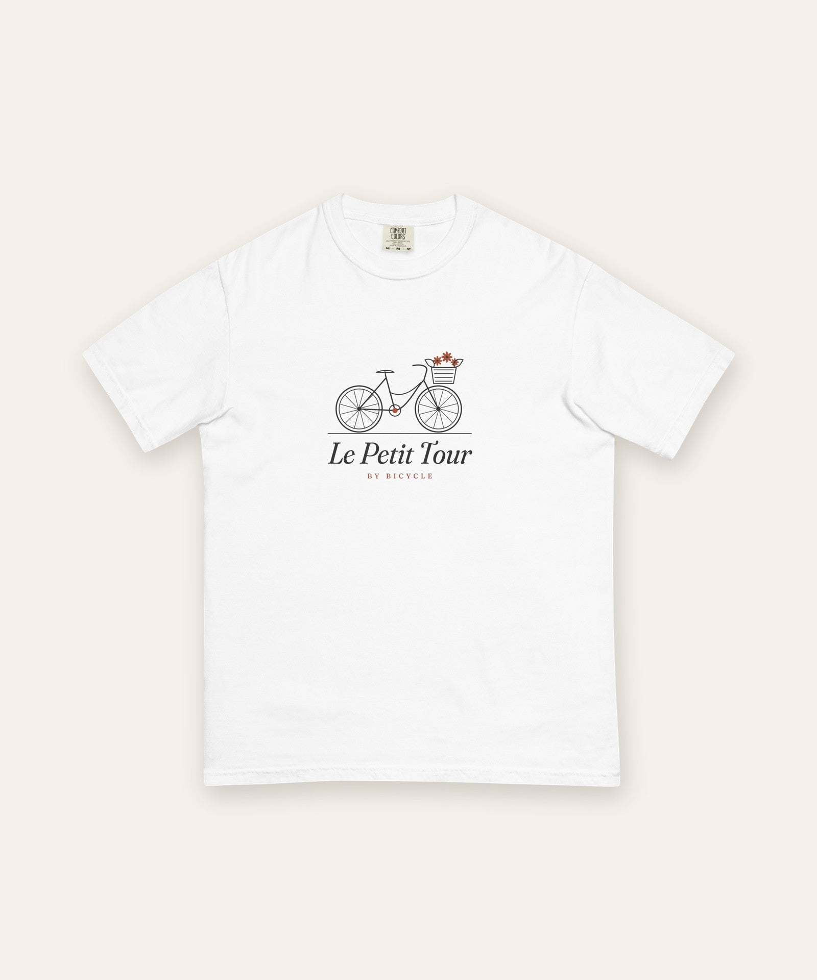 Le Petit Tour Tee in White, flat lay front, product shot on cream