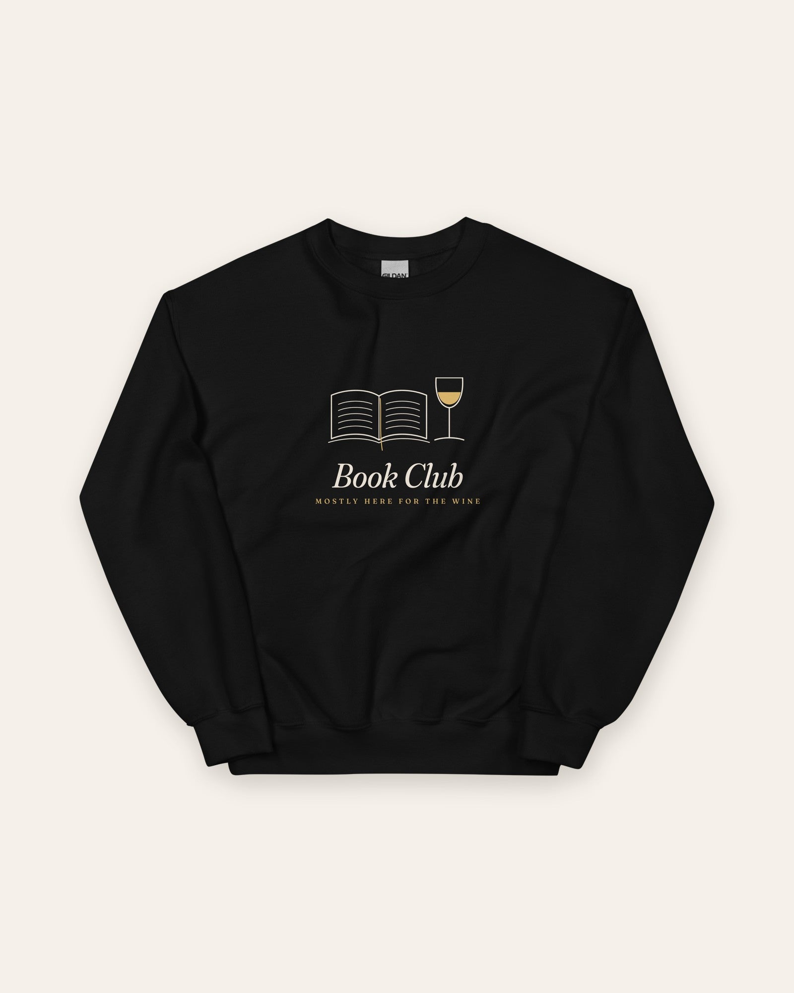 The Book Club Crewneck in Black, flat lay front, product shot on cream