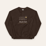 The Book Club Crewneck in Dark Chocolate, flat lay front, product shot on cream