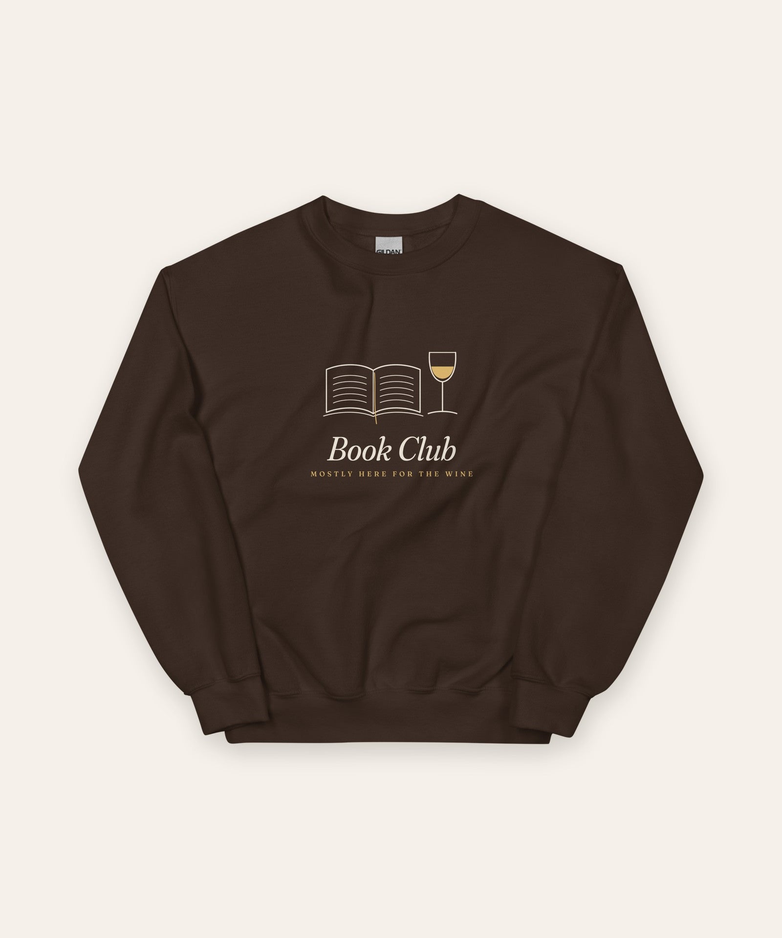 The Book Club Crewneck in Dark Chocolate, flat lay front, product shot on cream