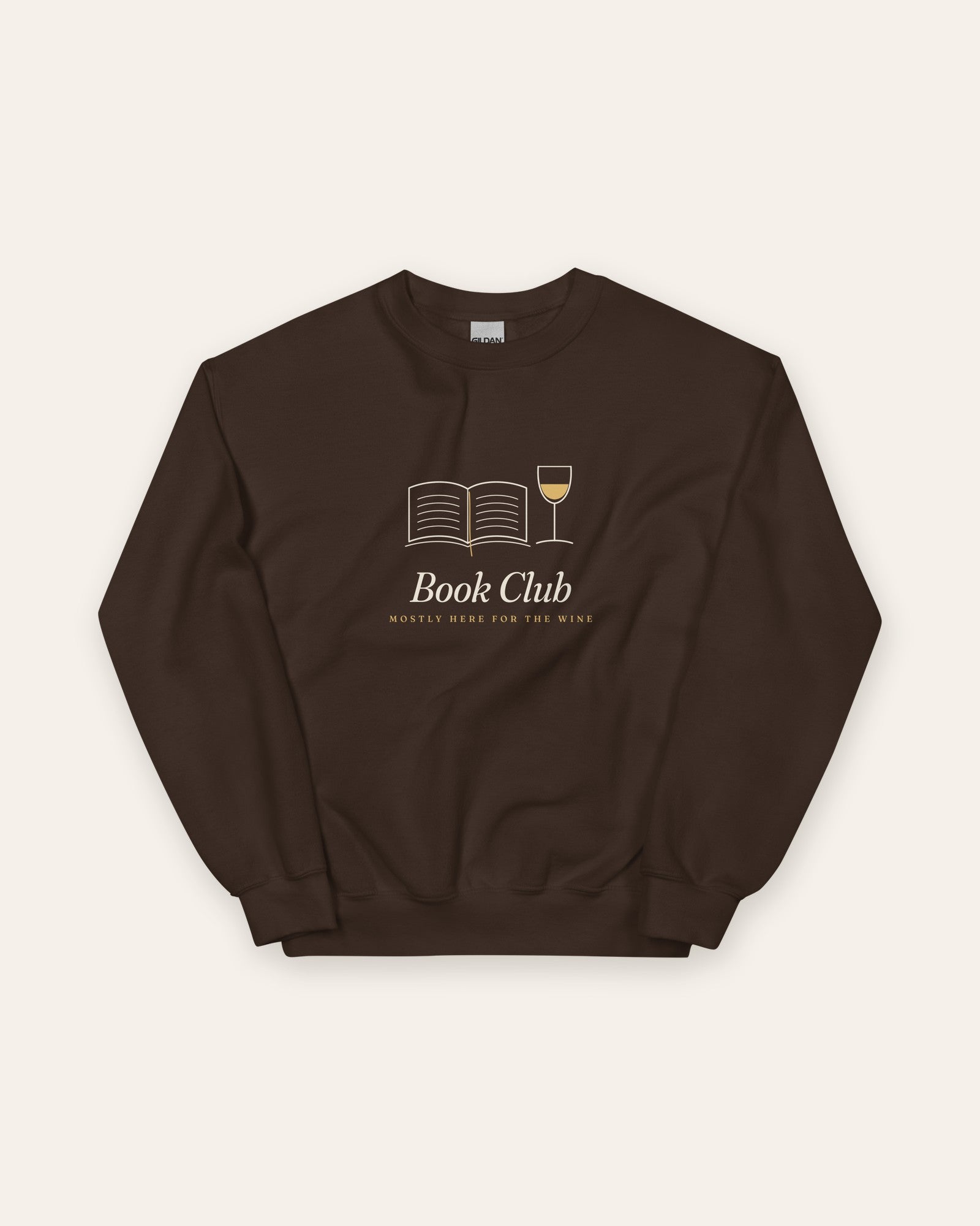 The Book Club Crewneck in Dark Chocolate, flat lay front, product shot on cream