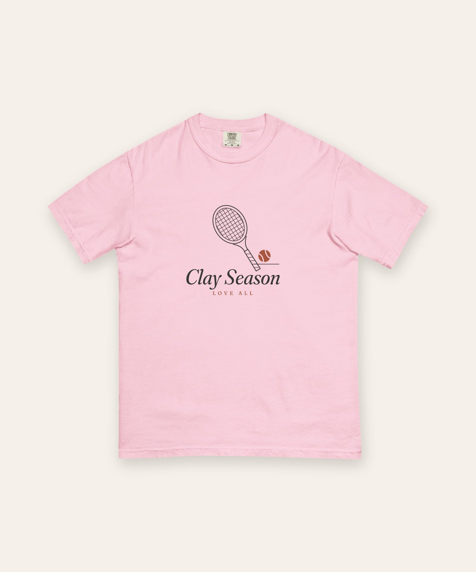 The Clay Season Tee in Blossom, flat lay front, product shot on cream
