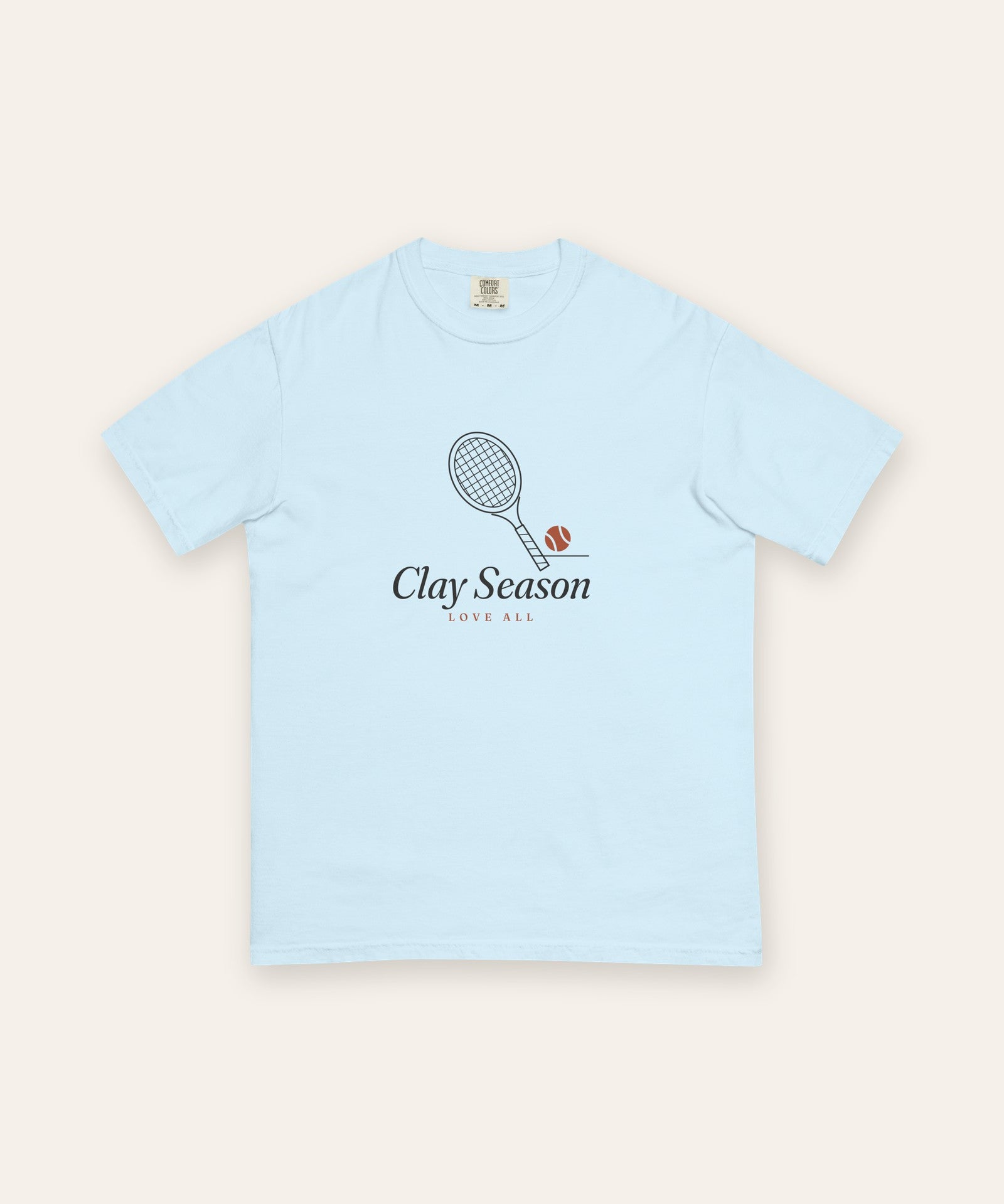 The Clay Season Tee in Chambray, flat lay front, product shot on cream