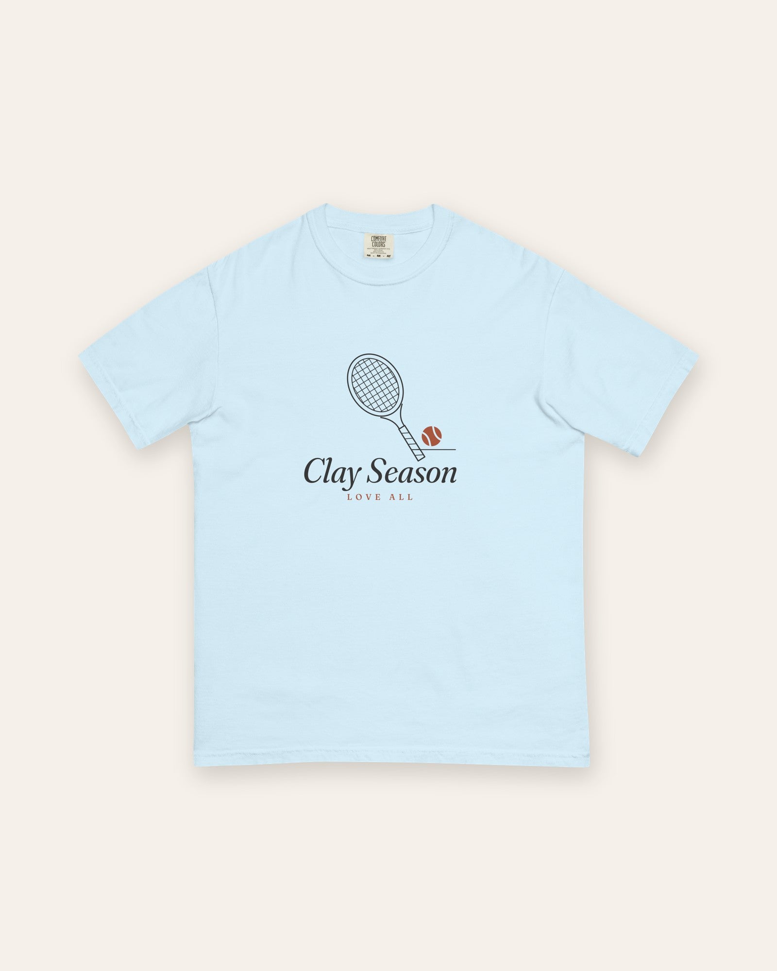 The Clay Season Tee in Chambray, flat lay front, product shot on cream