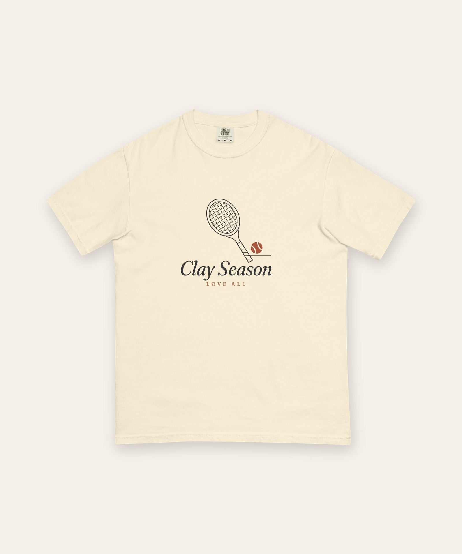 The Clay Season Tee in Ivory, flat lay front, product shot on cream