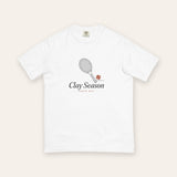The Clay Season Tee in White, flat lay front, product shot on cream