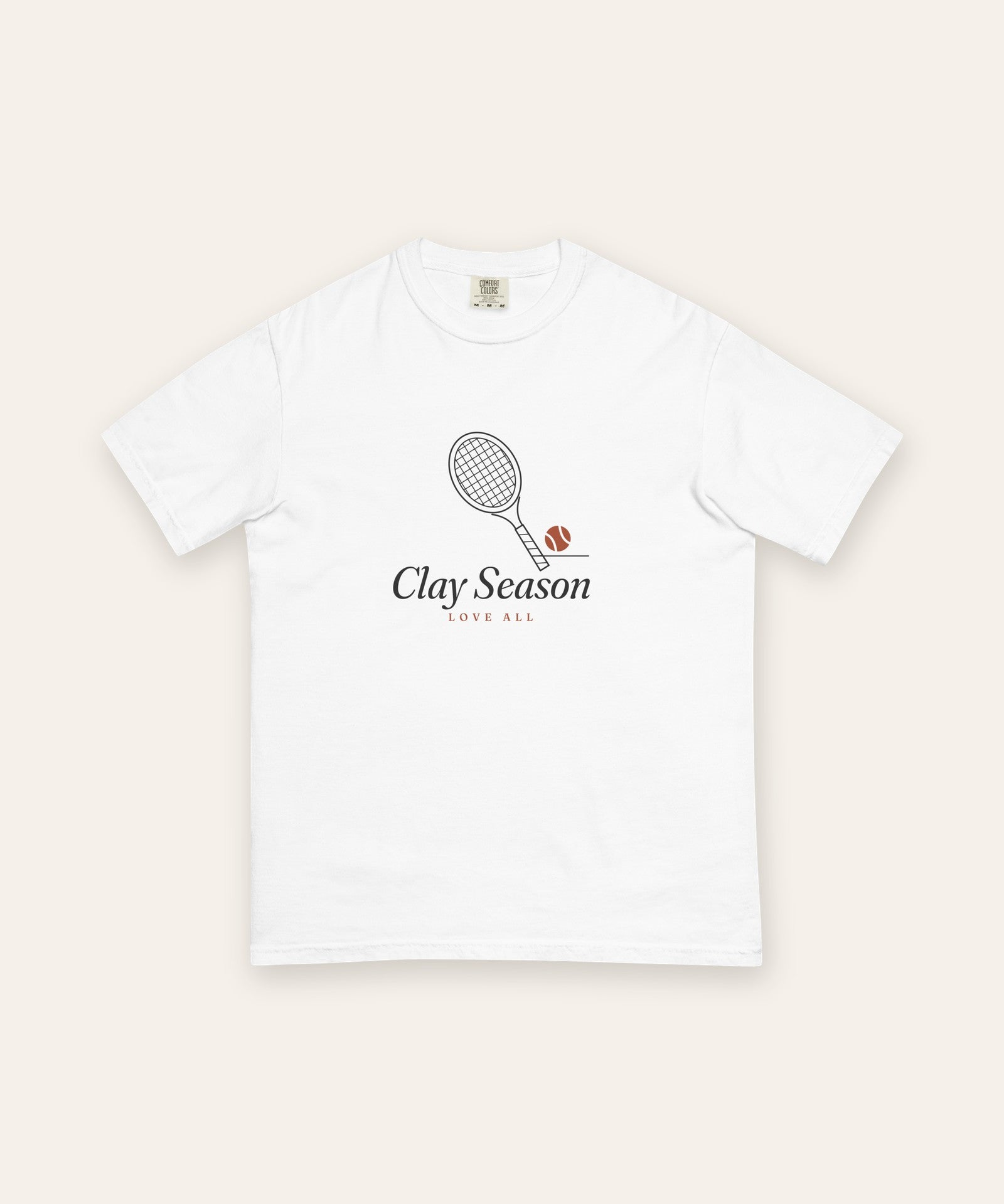 The Clay Season Tee in White, flat lay front, product shot on cream