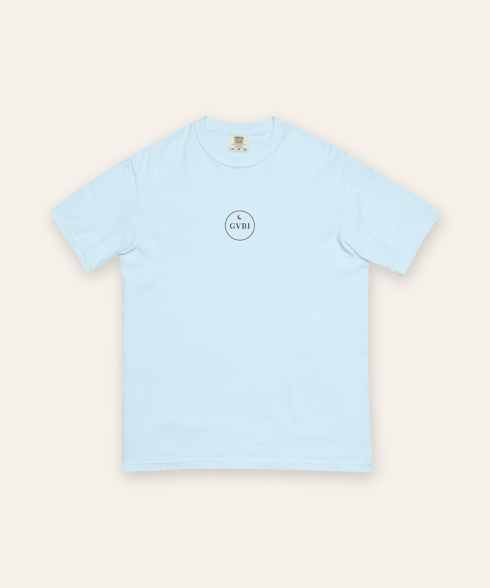 The House Crest Tee in Chambray, flat lay front, product shot on cream