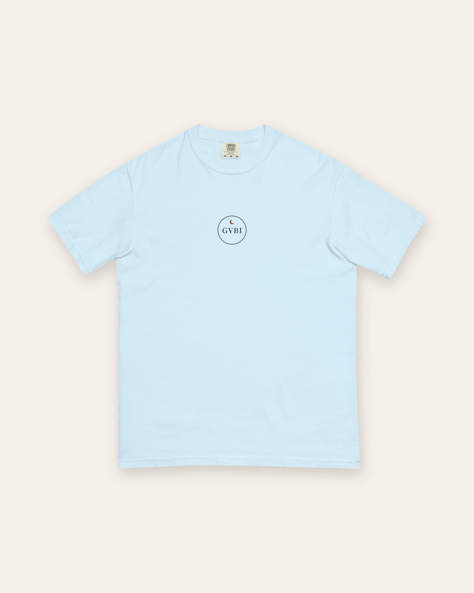 The House Crest Tee in Chambray, flat lay front, product shot on cream