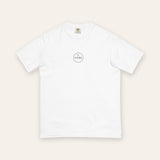The House Crest Tee in White, flat lay front, product shot on cream