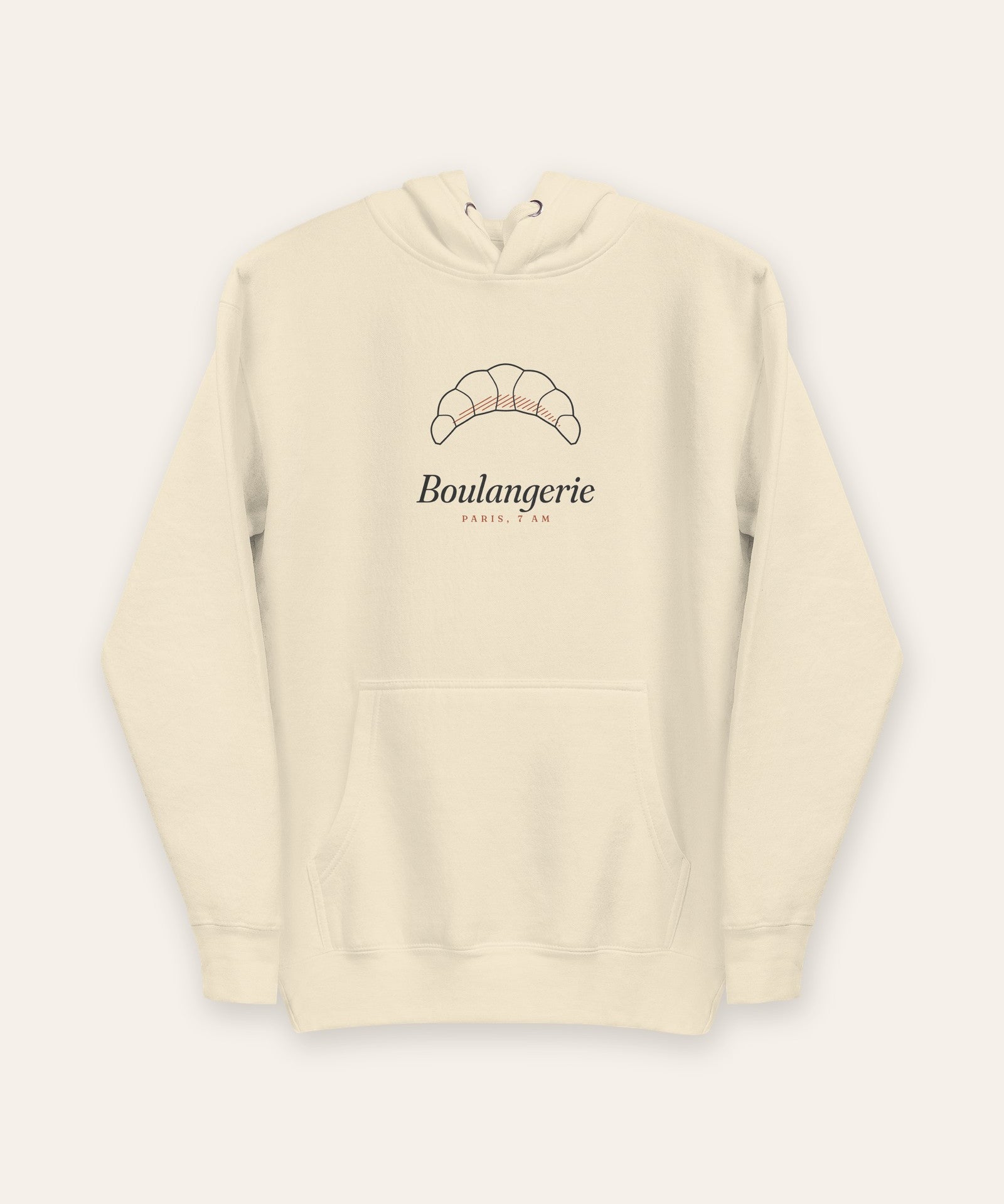The Boulangerie Hoodie in Bone, flat lay front, product shot on cream