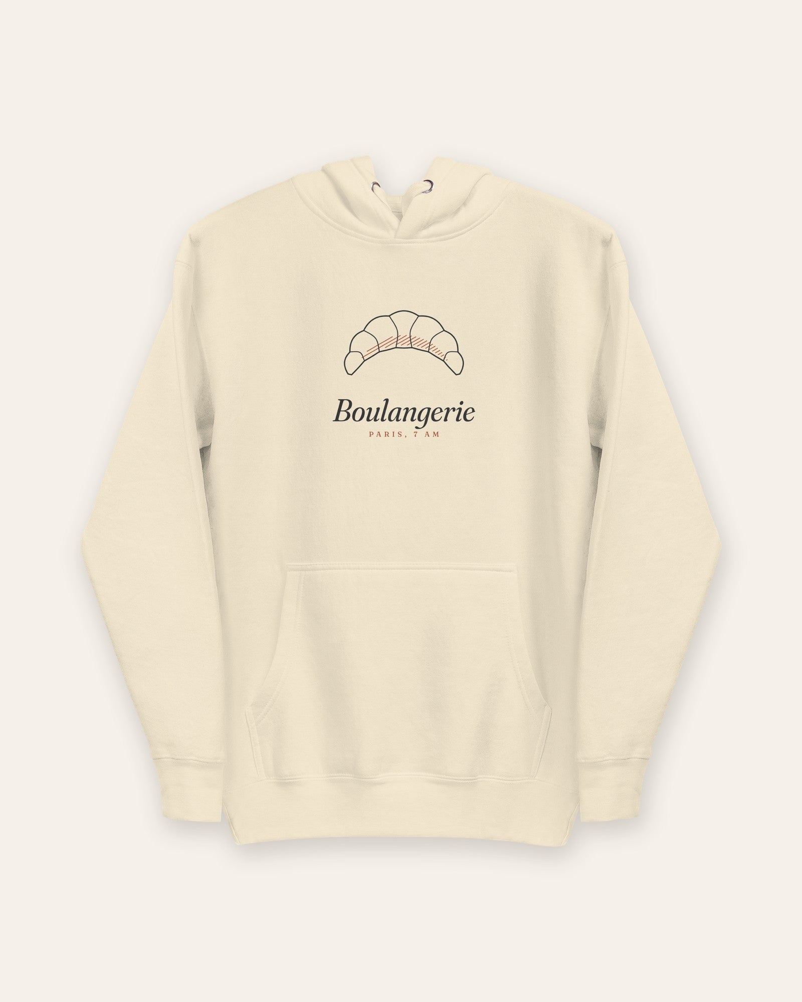 The Boulangerie Hoodie in Bone, flat lay front, product shot on cream