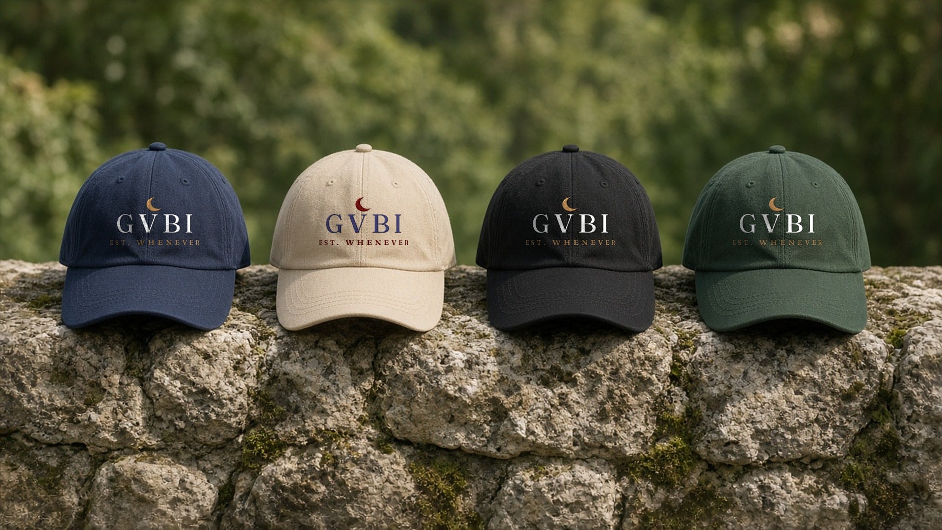 The House Dad Hat in Navy, Stone, Black, Spruce, all four colours on a stone wall, greenery behind