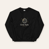 The Early Night Crewneck in Black, flat lay front, product shot on cream