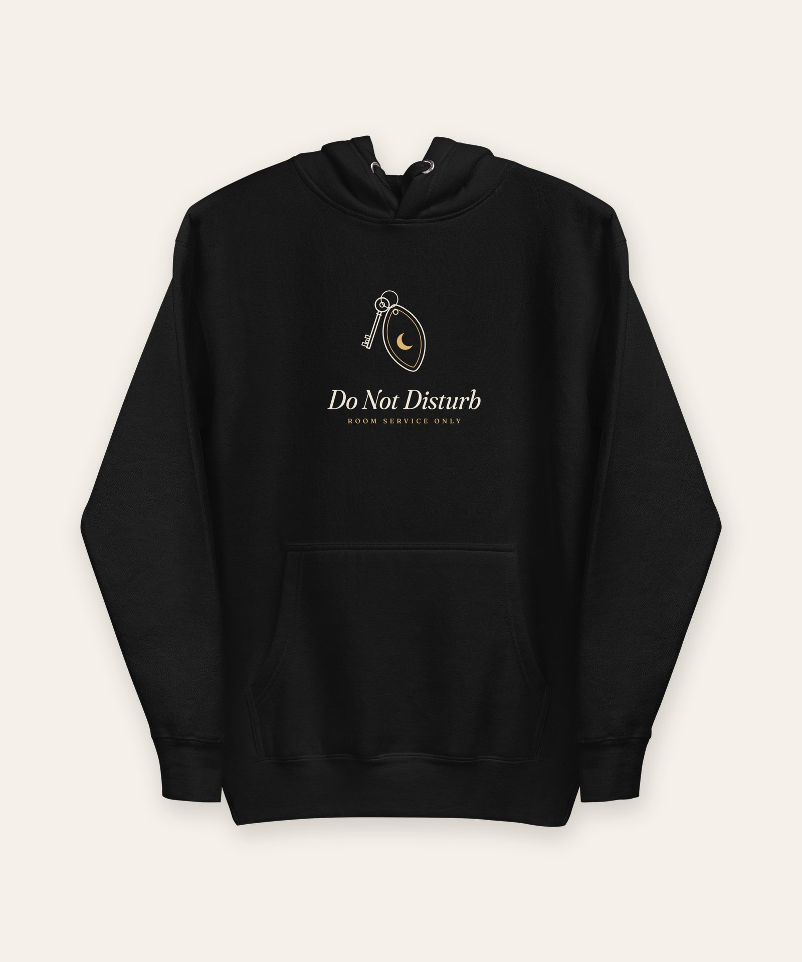 The Do Not Disturb Hoodie in Black, flat lay front, product shot on cream