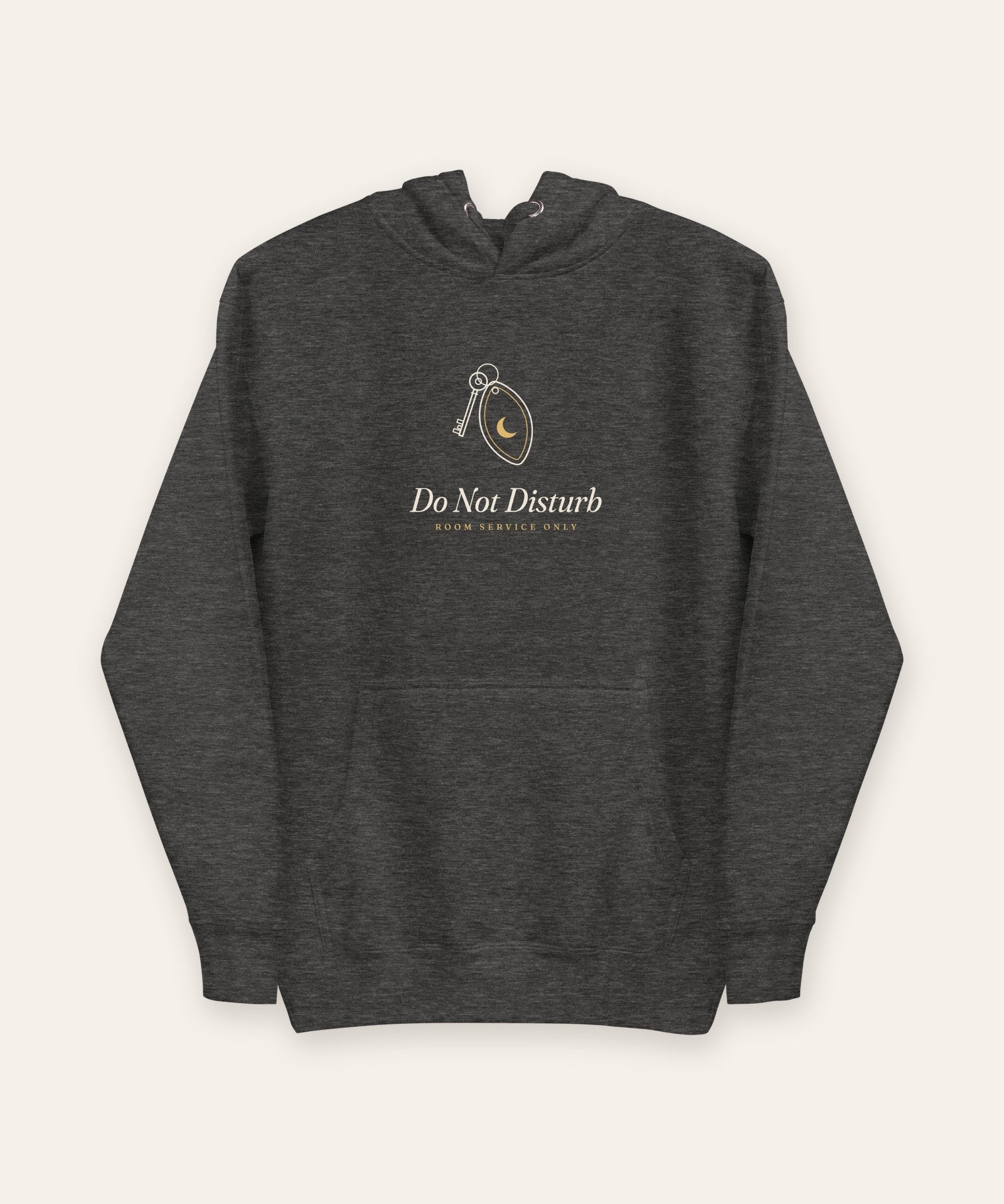 The Do Not Disturb Hoodie in Charcoal Heather, flat lay front, product shot on cream