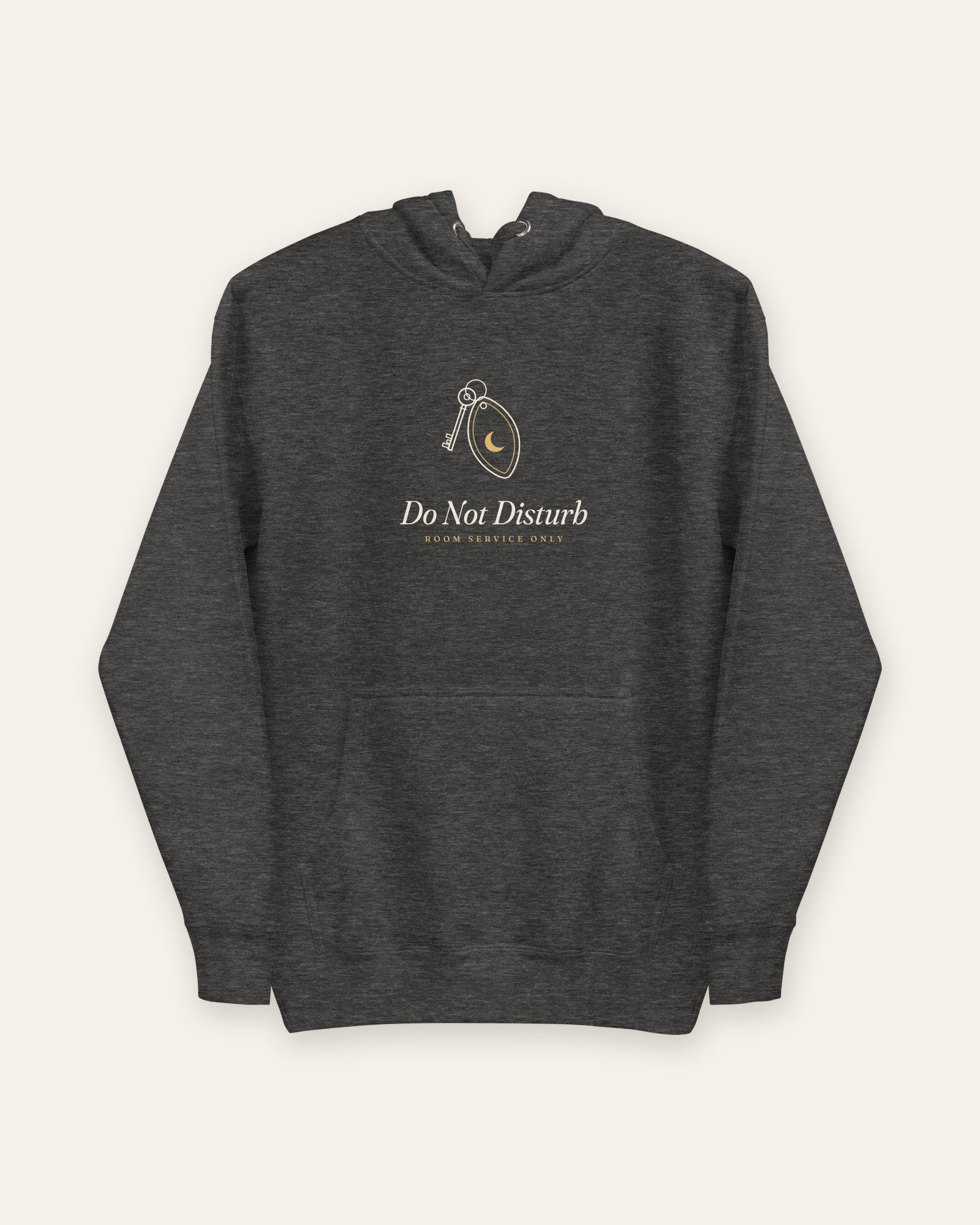 The Do Not Disturb Hoodie in Charcoal Heather, flat lay front, product shot on cream