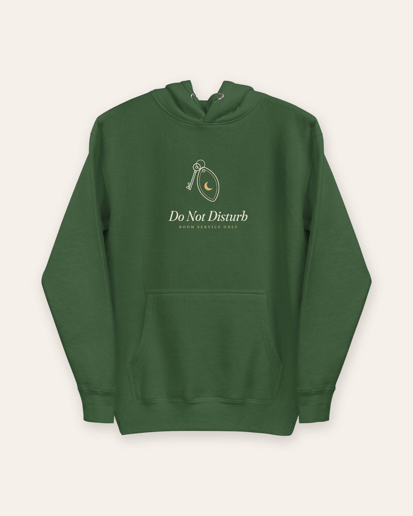 The Do Not Disturb Hoodie in Forest Green, flat lay front, product shot on cream
