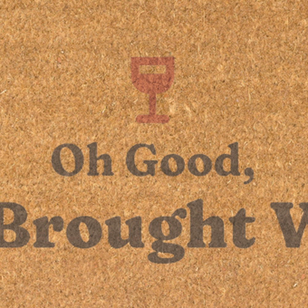 Close up of the terracotta wine glass above Oh Good,