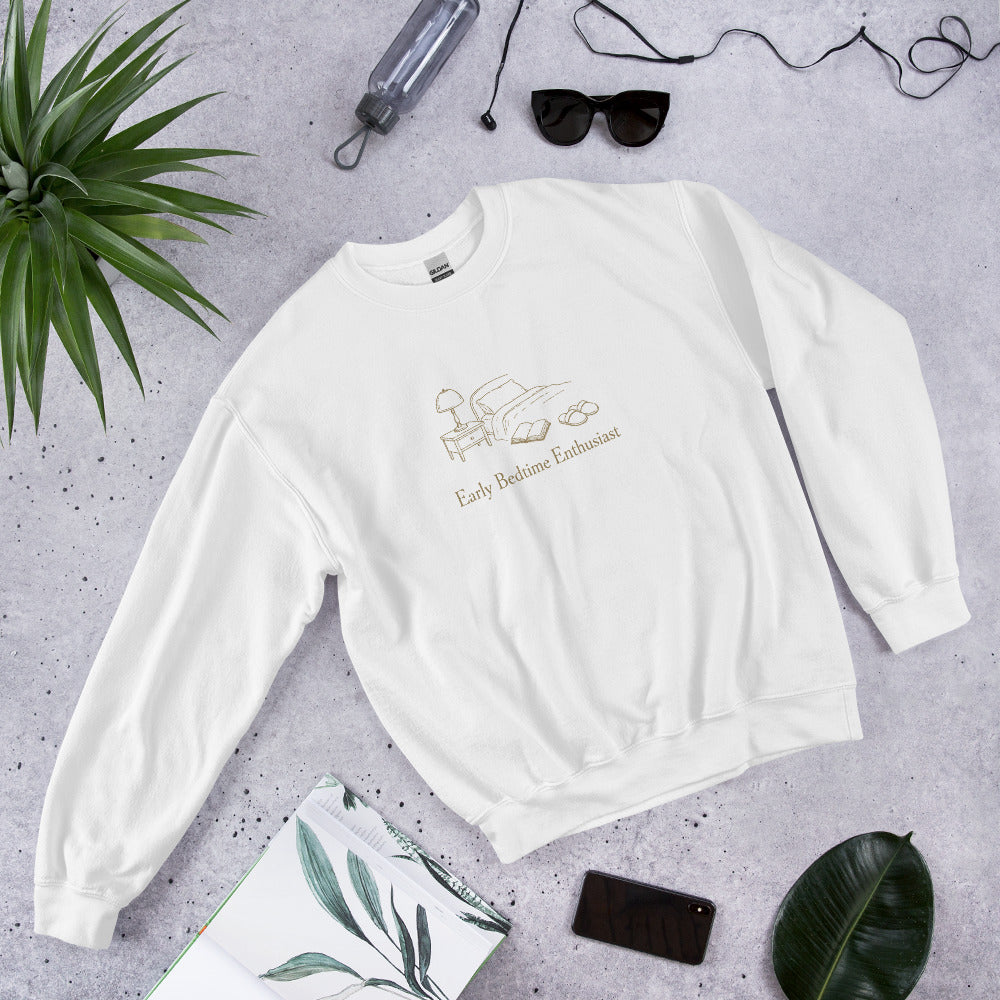 The Early Bedtime Enthusiast Crewneck in White, styled flat lay