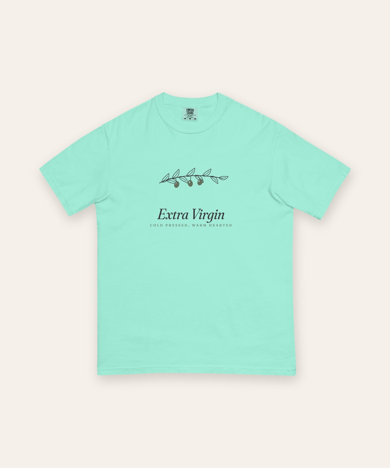 The Extra Virgin Tee in Chalky Mint, flat lay front, product shot on cream