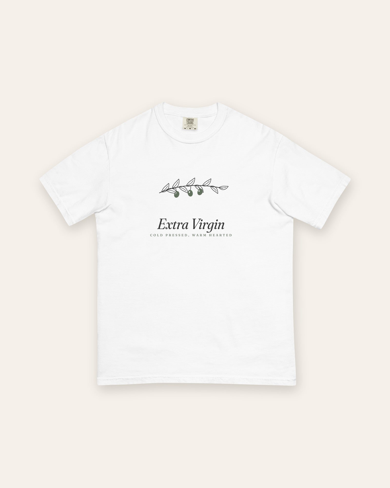 The Extra Virgin Tee in White, flat lay front, product shot on cream