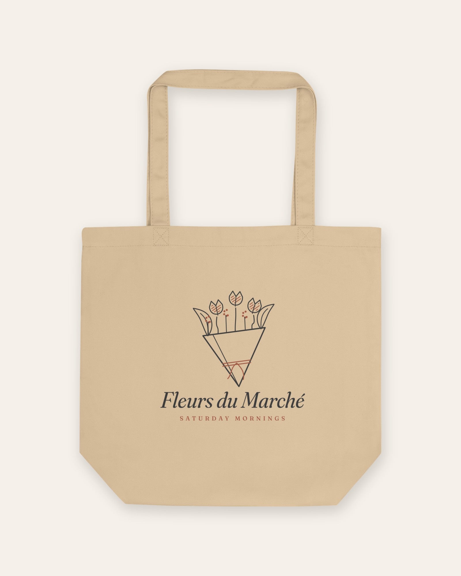 The Fleurs du Marché Tote in Oyster, flat lay front, product shot on cream