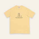 The Grate Expectations Tee in Butter, flat lay front, product shot on cream