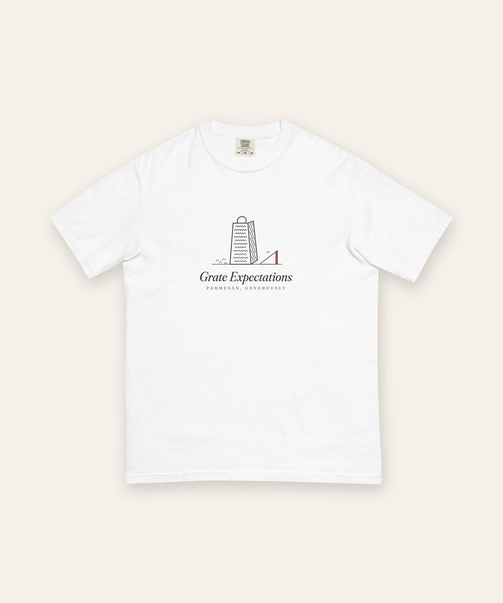 The Grate Expectations Tee in White, flat lay front, product shot on cream
