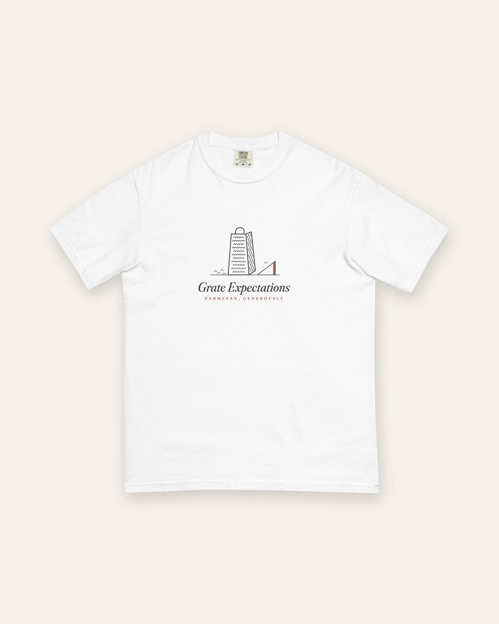 The Grate Expectations Tee in White, flat lay front, product shot on cream