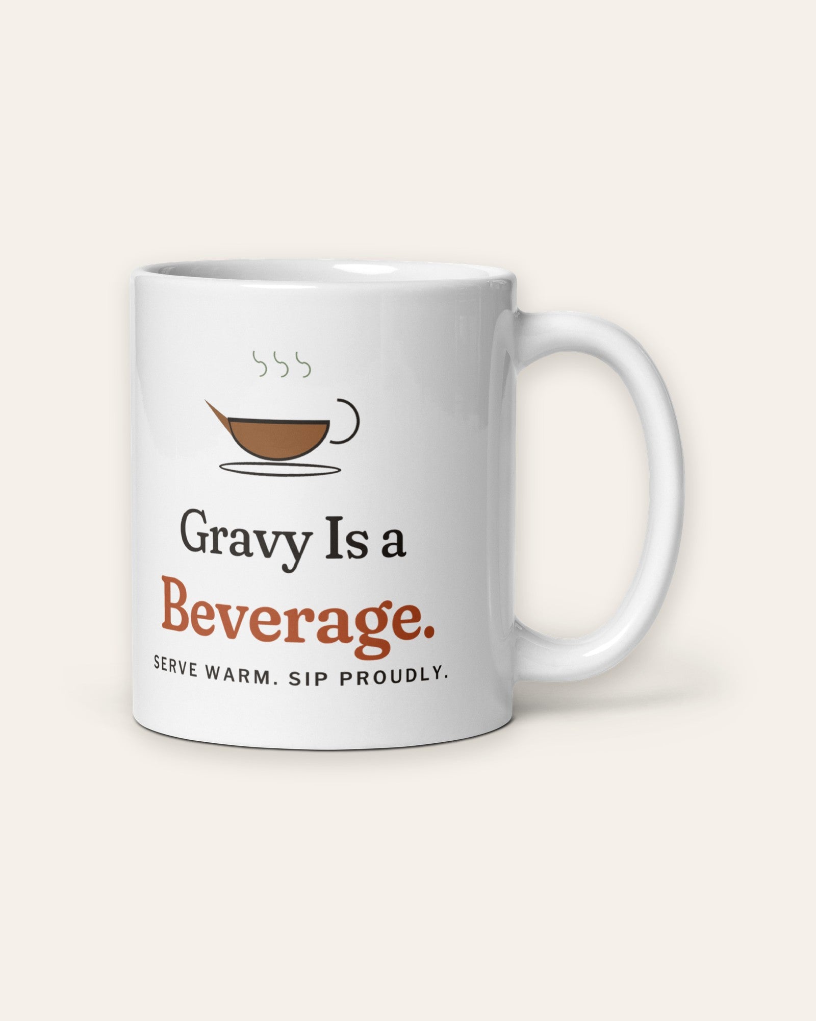 The Gravy Is a Beverage Mug, 11 oz, front, handle on right, product shot on cream
