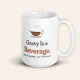 The Gravy Is a Beverage Mug, 15 oz, front, handle on right, product shot on cream
