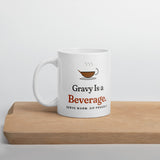 The Gravy Is a Beverage Mug on a wooden cutting board