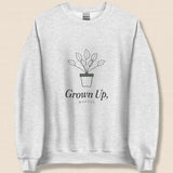 The Grown Up, Mostly Crewneck in Ash, flat lay on linen