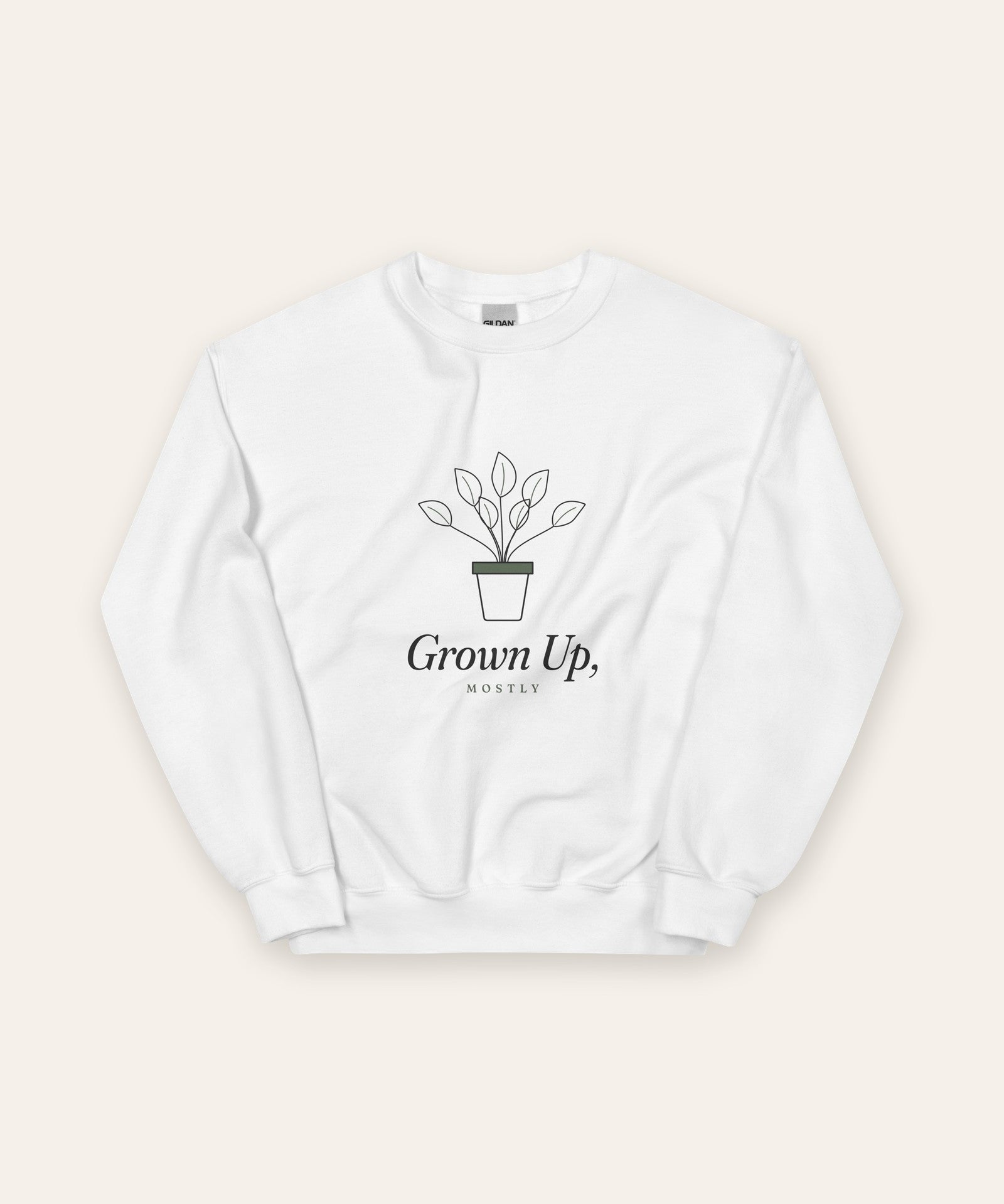 The Grown Up, Mostly Crewneck in White, flat lay front, product shot on cream