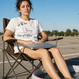 The Out of Office Tee in White, feet in a kiddie pool in an empty parking lot