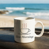 The Slow Mornings Mug on a van dashboard facing the surf