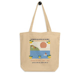 The Lemons & Long Lunches Tote in Natural, on a hook