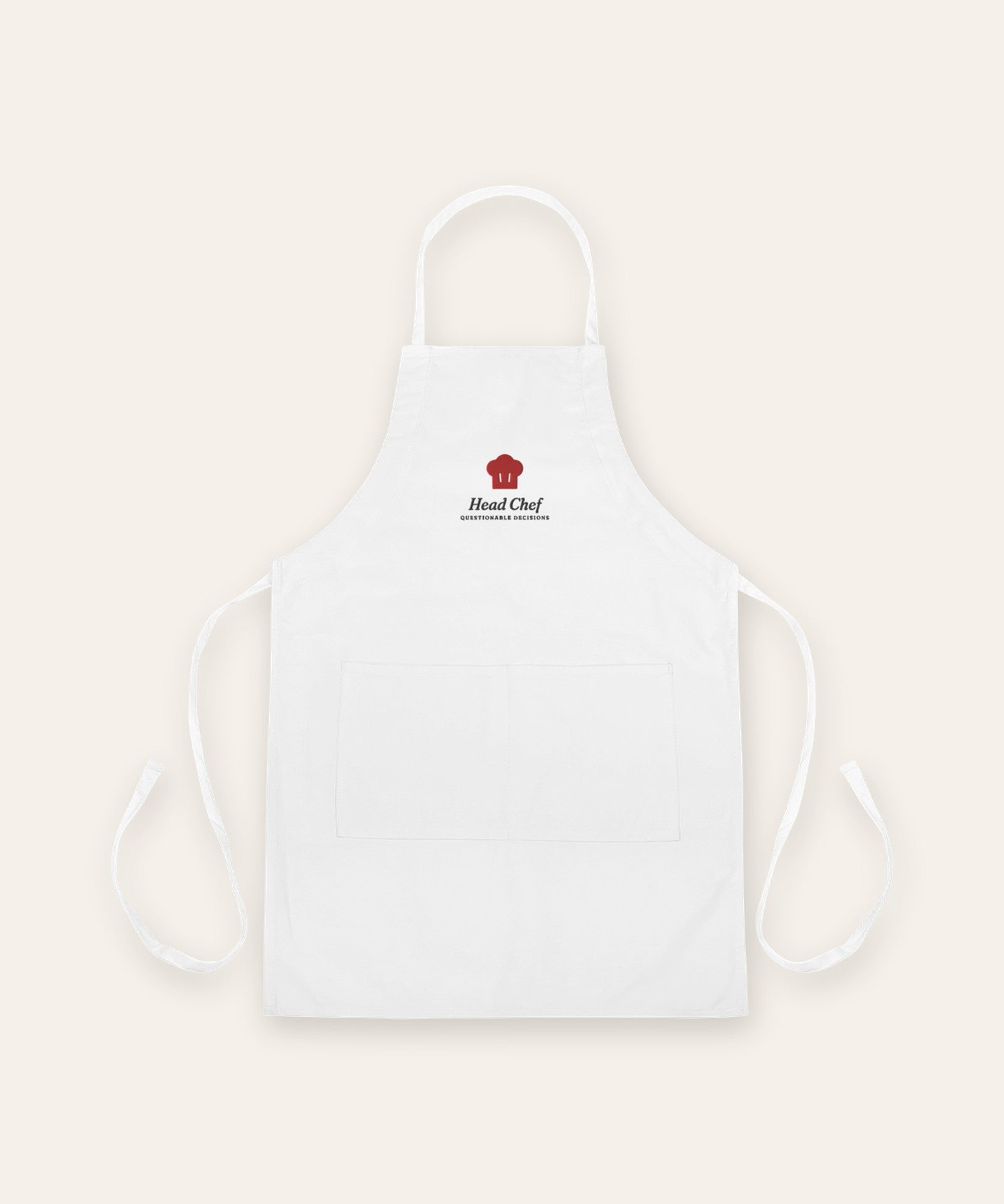 The Head Chef Apron in White, flat lay front, product shot on cream