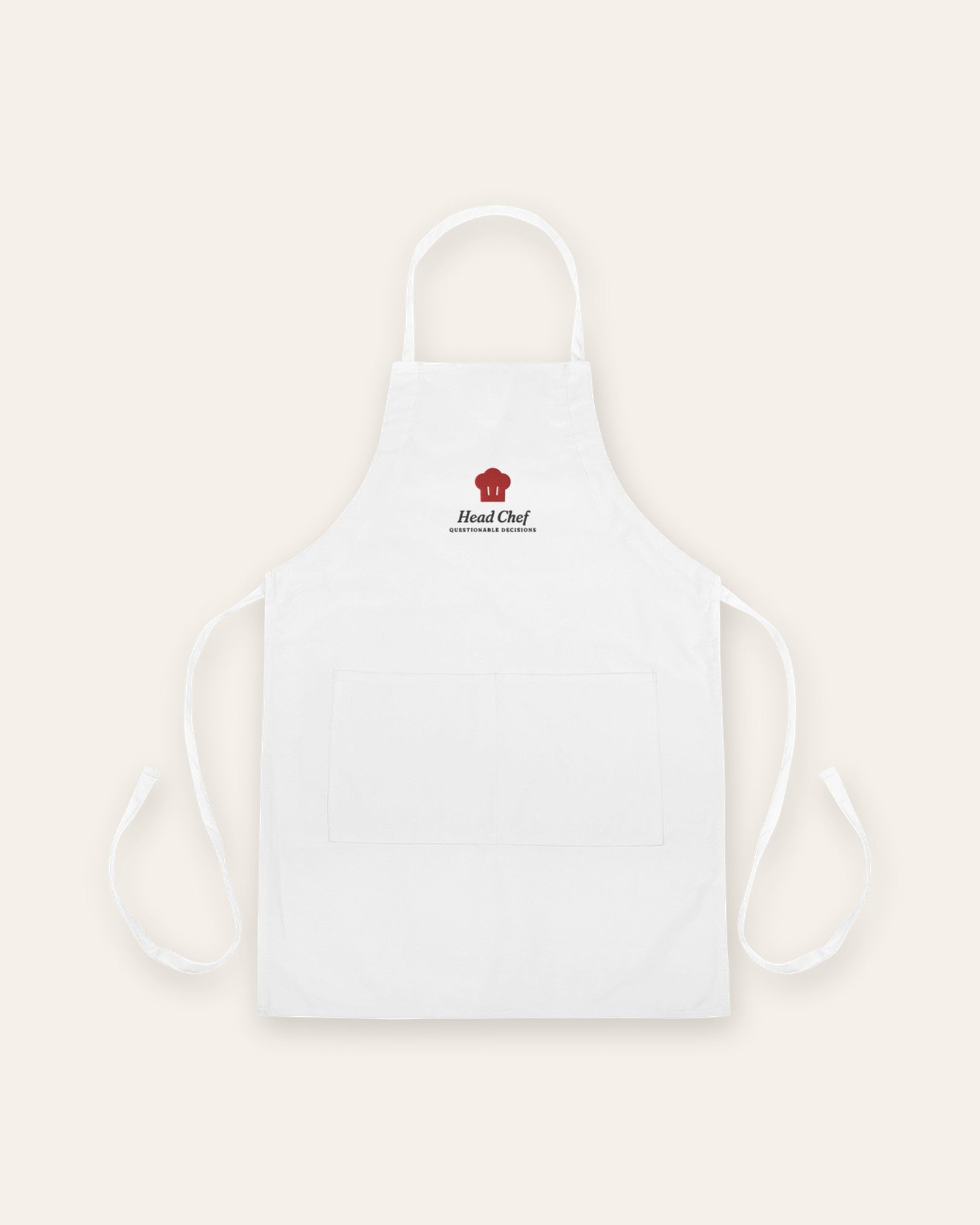 The Head Chef Apron in White, flat lay front, product shot on cream