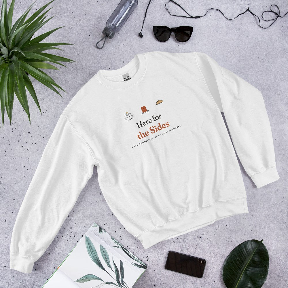 The Here for the Sides Crewneck in White, flat lay with sunglasses, a plant and a notebook