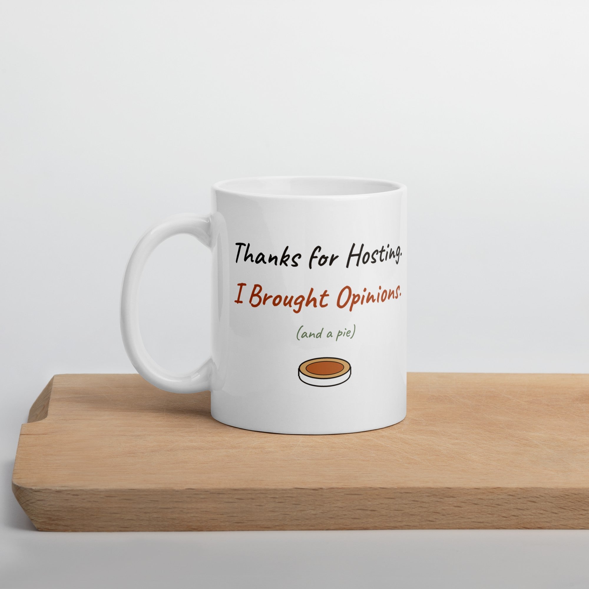 The Thanks for Hosting Mug on a wooden cutting board